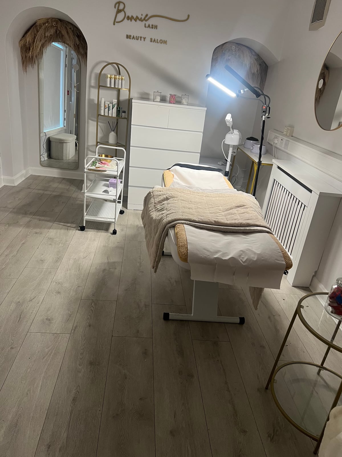 A cosy treatment bed and gold details inside the Bonnie and Co salon